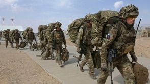 British troops prepare to depart upon the end of operations for U.S. Marines and British combat troops in Helmand
